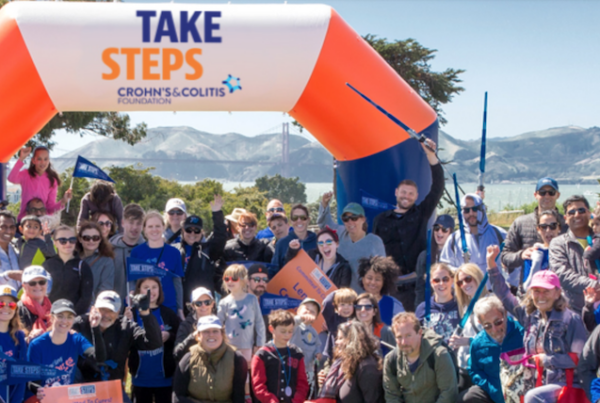 A crowd of people at the finish line of the Take Steps walk